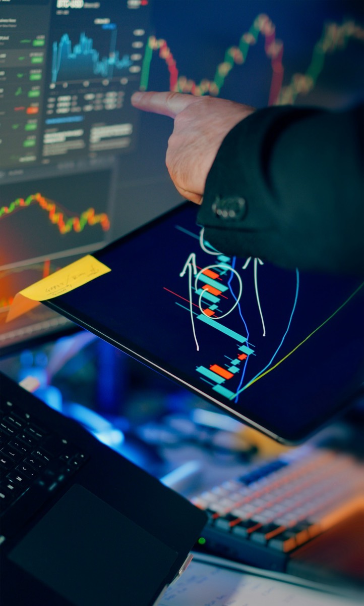 Analyst reviewing the day's charts before writing the evening brief